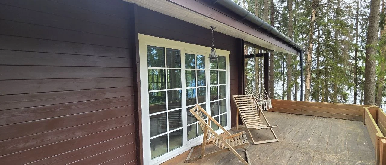 PIONEER cabin with a terrace in a pine forest